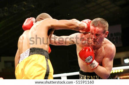 KIEV, UKRAINE - APRIL 19: WBA welterweight belt holder Yuriy Nuzhnenko (R) throws a punch against Irving Garcia during their WBA World Welterweight Title fight on April 19, 2008 in Kyiv, Ukraine