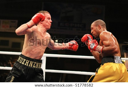 KIEV, UKRAINE - APRIL 19: WBA welterweight belt holder Yuriy Nuzhnenko(L) throws a punch against Irving Garcia during their WBA World Welterweight Title fight on April 19, 2008 in Kyiv, Ukraine