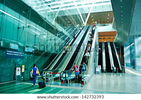 SINGAPORE - MARCH 05 : Escalators at Changi International Airport on March 05, 2013 in Singapore. Changi Airport serves more than 100 airlines operating 6,100 weekly flights