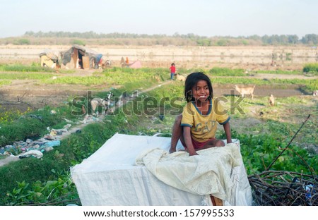 Delhi - March 02: Unidentified Poor Girl On March 02, 2012 In Delhi, India. 32.7% Of The Total Indian People Fall Below The International Poverty Line Of Us$ 1.25 Per