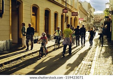 LJUBLJANA, SLOVENIA - SEPTEMBER 4: People on the crowded street of old town on September 4, 2013 in Ljubljana. This year the city of Ljubljana is competing for the title of European Green Capital 2016
