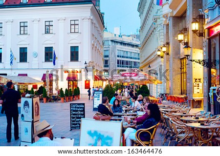 BRATISLAVA - AUGUST 31: Tourists are chilling in cafe on Main Square in city downtown on August 31, 2013 in Bratislava. Recently the biggest in slovakia internatioanl cha-cha contest took place here