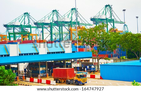 Singapore commercial port. It\'s the world\'s busiest port in terms of total shipping tonnage, it transships a fifth of the world shipping containers Stock Photo: