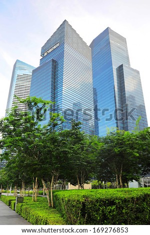 SINGAPORE - MARCH 05: Modern park and scyscraper in Singapore on March 05, 2013 in Singapore. There are more than 7,000 multinational corporations from United States, Japan and Europe in Singapore.