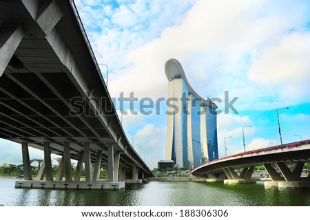 SINGAPORE - MARCH 06, 2013: Marina Bay Sands Resort across the river in Singapore. It is billed as the world\'s most expensive standalone casino property at S$8 billion