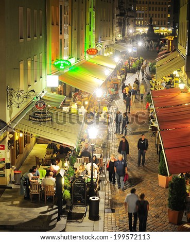 DRESDEN, GERMANY - SEPT 19, 2012: The Munzgasse is not only the largest mile of restaurants but also a typical sign of the Saxon hospitality.There you can find cafe and bars, restaurants.