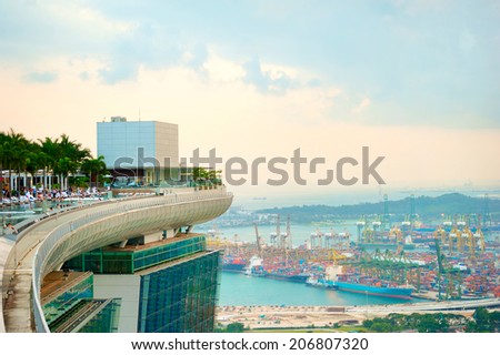 SINGAPORE - MARCH 07, 2013: View from Marina Bay hotel to Singapore industrial port. It\'s the world\'s busiest port in terms of total shipping tonnage