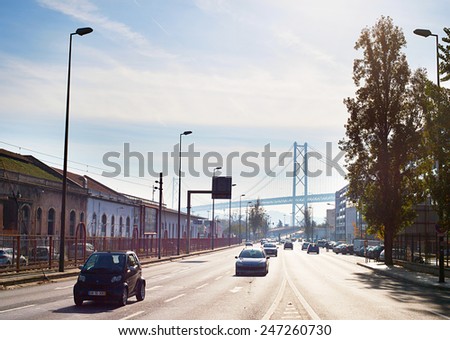 LISBON, PORTUGAL - DECEMBER 20, 2014: Cars on the road in Lisbon. Portugal has a 68,732 km  network of roads, of which almost 3,000 km are part of a 44 motorways system.