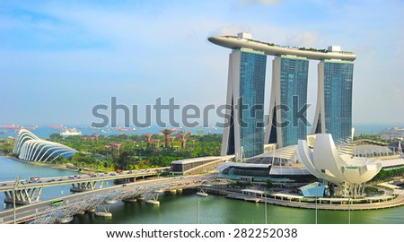 SINGAPORE - MARCH 03, 2013: Marina Bay Sands and Garden by the bay in Singapore. Marina Bay Sands Resort is billed as the world\'s most expensive standalone casino property at S$8 billion