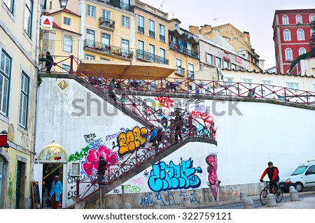 LISBON, PORTUGAL - DEC 12, 2014: People at Old Town street of Lisbon. Lisbon is the capital of Portugal