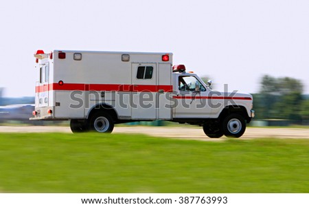 Emergency ambulance driving very fast