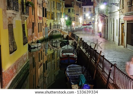 Narrow canal in Venice at night Italy