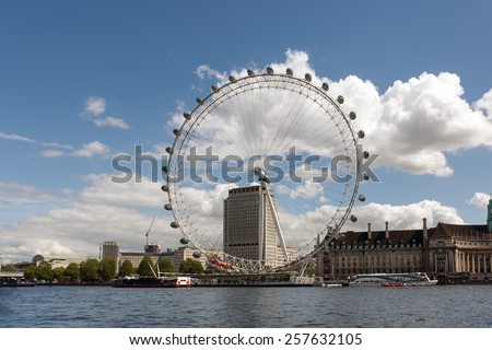 LONDON, ENGLAND - MAY 12, 2014: View of the London Eye. London Eye (135 m tall, diameter of 120 m) - a famous tourist attraction over river Thames in the capital city London.