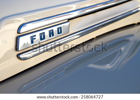 BURBANK, CA - FEBRUARY 20, 2015: Classic 1950 Ford truck chrome hood emblem and trim close up. This was Ford\'s first generation of trucks based on a truck platform, and not a car chassis.