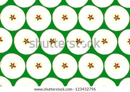 Collage of cut apples packed in rows against a green background