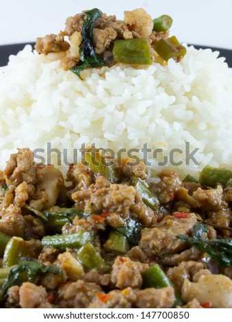 image of Fried basil leave with pork on rice is popular food of the thailand
