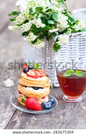 puff pastry with berries and beautiful bouquet of white flowers