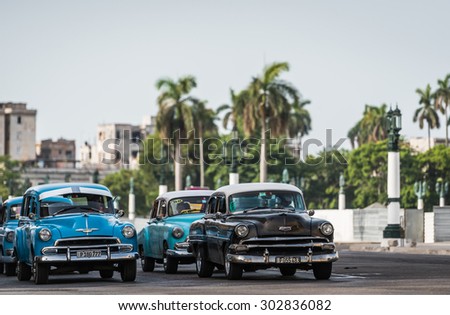 HAVANA, CUBA - JULY 05, 2015: American vintage car driving on the street in front of the Capitol in Havana