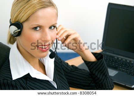 Young operator calling with customer