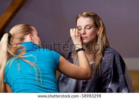 Make-up session - two young beautiful women
