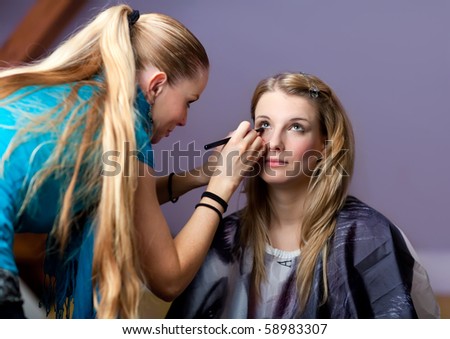 Make-up session - two young beautiful women