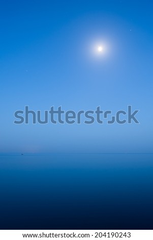 Blue twilight on the sea with moon