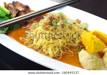 Egg chinese dry noodles with roast  pork, dumpling