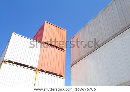 Stacked cargo containers in storage area of freight sea port terminal