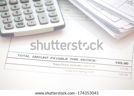 Business document of tax invoice form with calculator