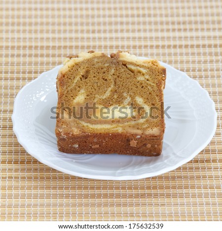 Sponge cake mocca on bamboo plate background