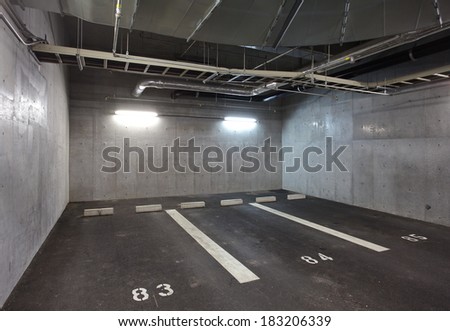 Parking garage underground interior, neon lights in dark