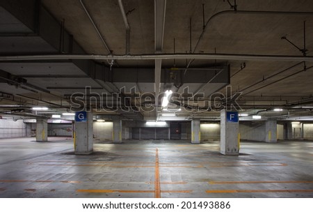 Parking garage underground interior, neon lights in dark