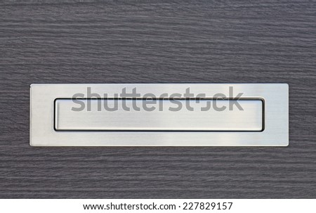 Metal post box and modern wood door