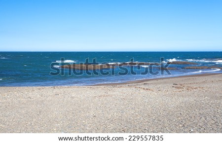 Clean sand beach with blue sky and sea in sunny day