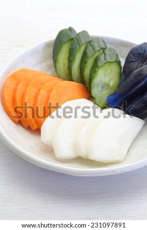 Traditional Japanese vegetable pickle , cucumber , carrot , radish , eggplant
