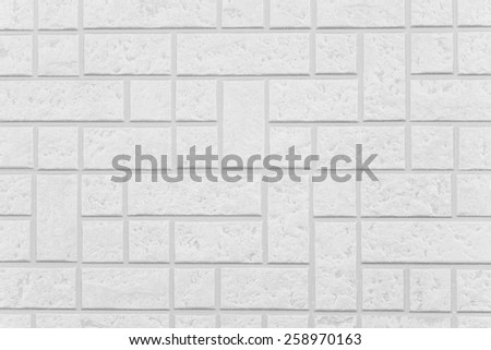 THe modern white concrete tile wall background and texture .