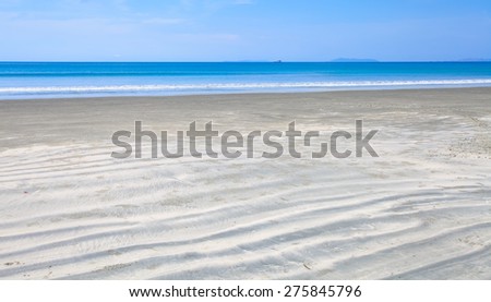Beautiful and clean sand beach with nice blue sea and sky