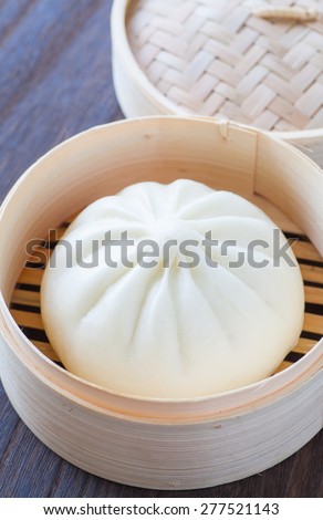 Traditional chinese cuisines steamed bun in asian style bamboo basket