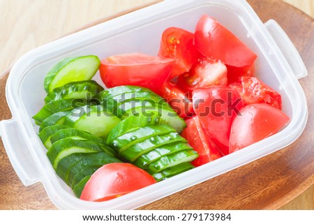 Slice cucumber  and slice tomato in plastic lunch box
