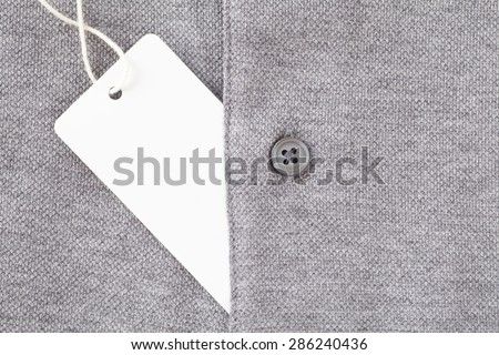 Close - up Blank tag label on grey shirt