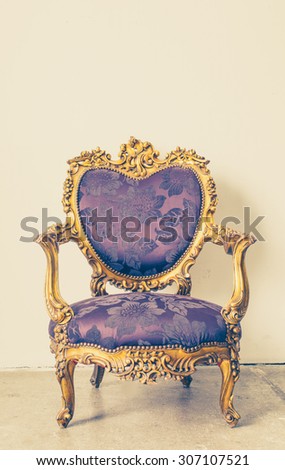 Vintage and antique chair with white wall background