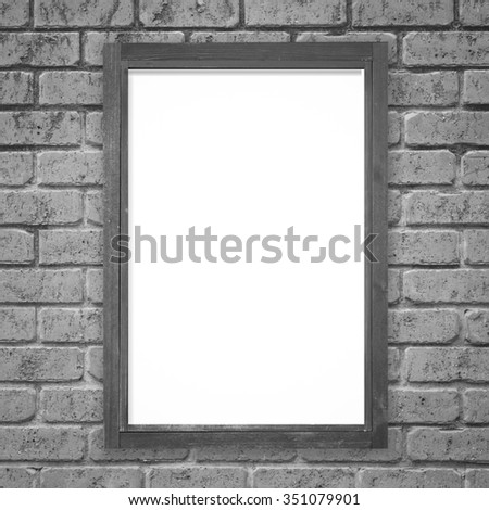 Black wood picture frame on white brick wall