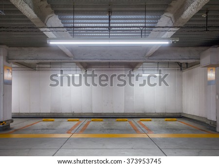 Empty space car park interior at night
