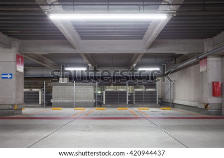 Parking garage underground interior, neon lights at night