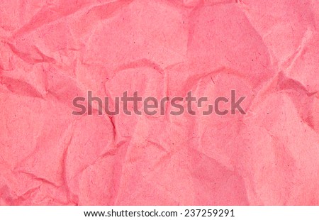 Crumpled recycled red paper background texture