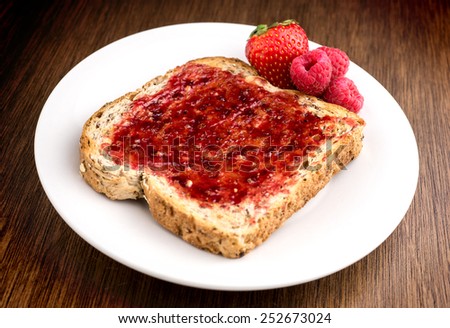 Mixed fruit jam on healthy whole wheat multi grain toast