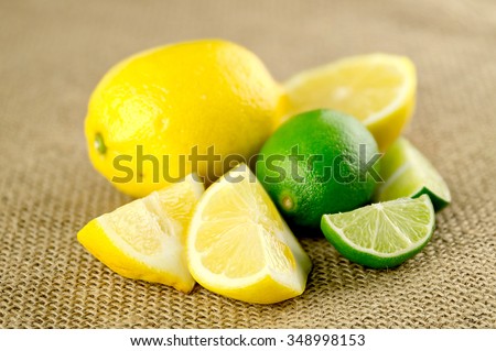 Cut up lemons and limes, sour citrus fruits