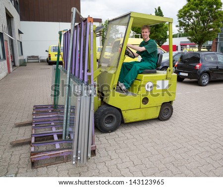 Glazier operating a forklift truck
