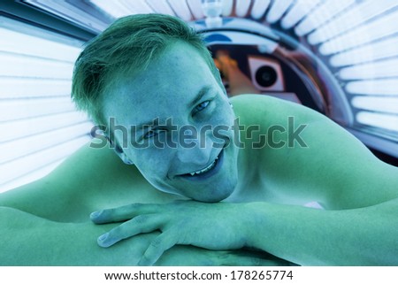 Customer or client in a solarium on tanning bed