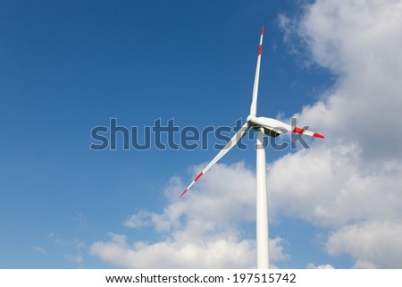 A wind turbine for clean energy production with blue sky